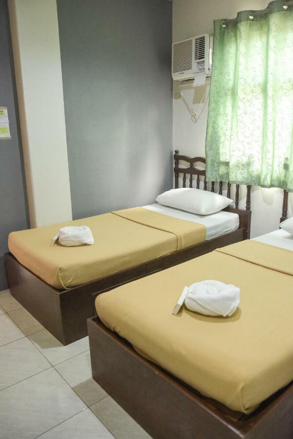 Tiptop Tower Suite Inn Dumaguete City Номер фото